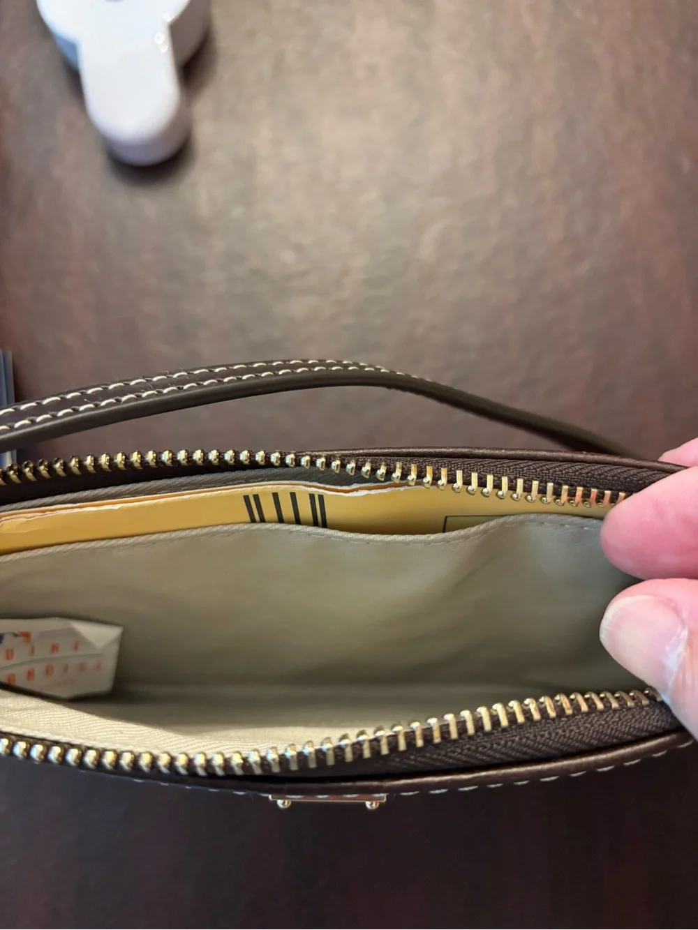Dooney & Bourke Mustard Yellow Logo-Embossed Wristlet with Brown Trim
